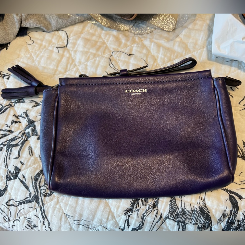 Never used, Coach, purple/plum wristlet wallet. Great condition.